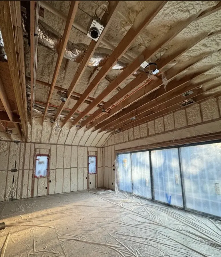 Interior walls and ceiling insulated with spray foam during new construction in Santa Fe Springs